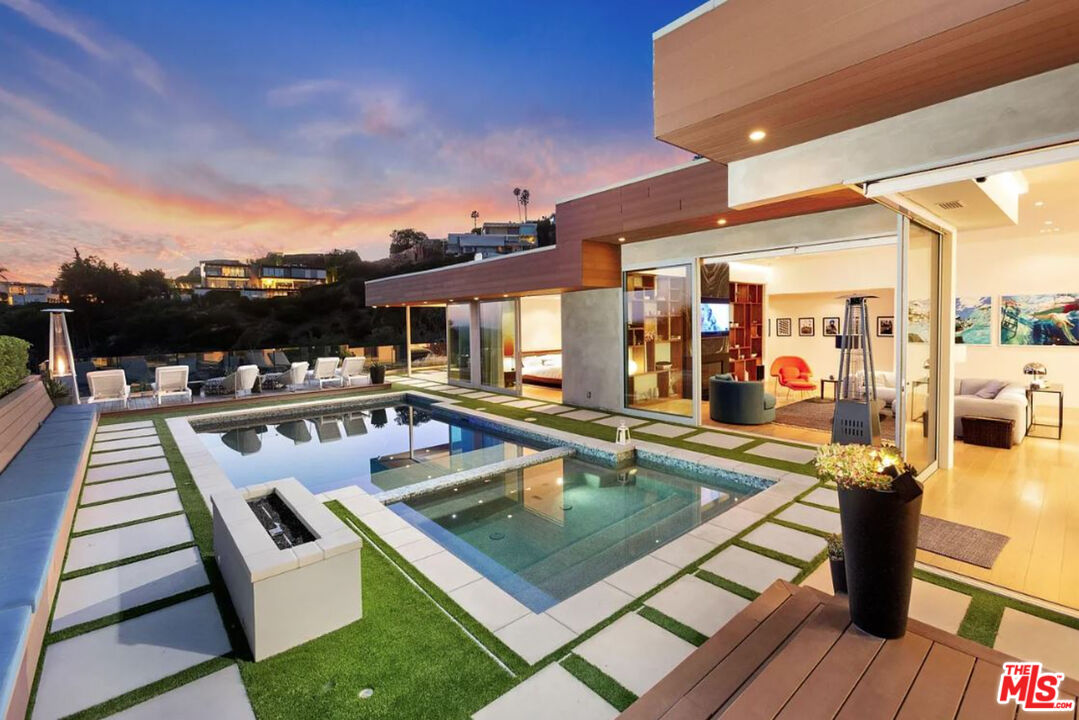 1429 Devlin Drive Los Angeles, CA 90069 - Photo 51 of 58 a view of a swimming pool with a patio