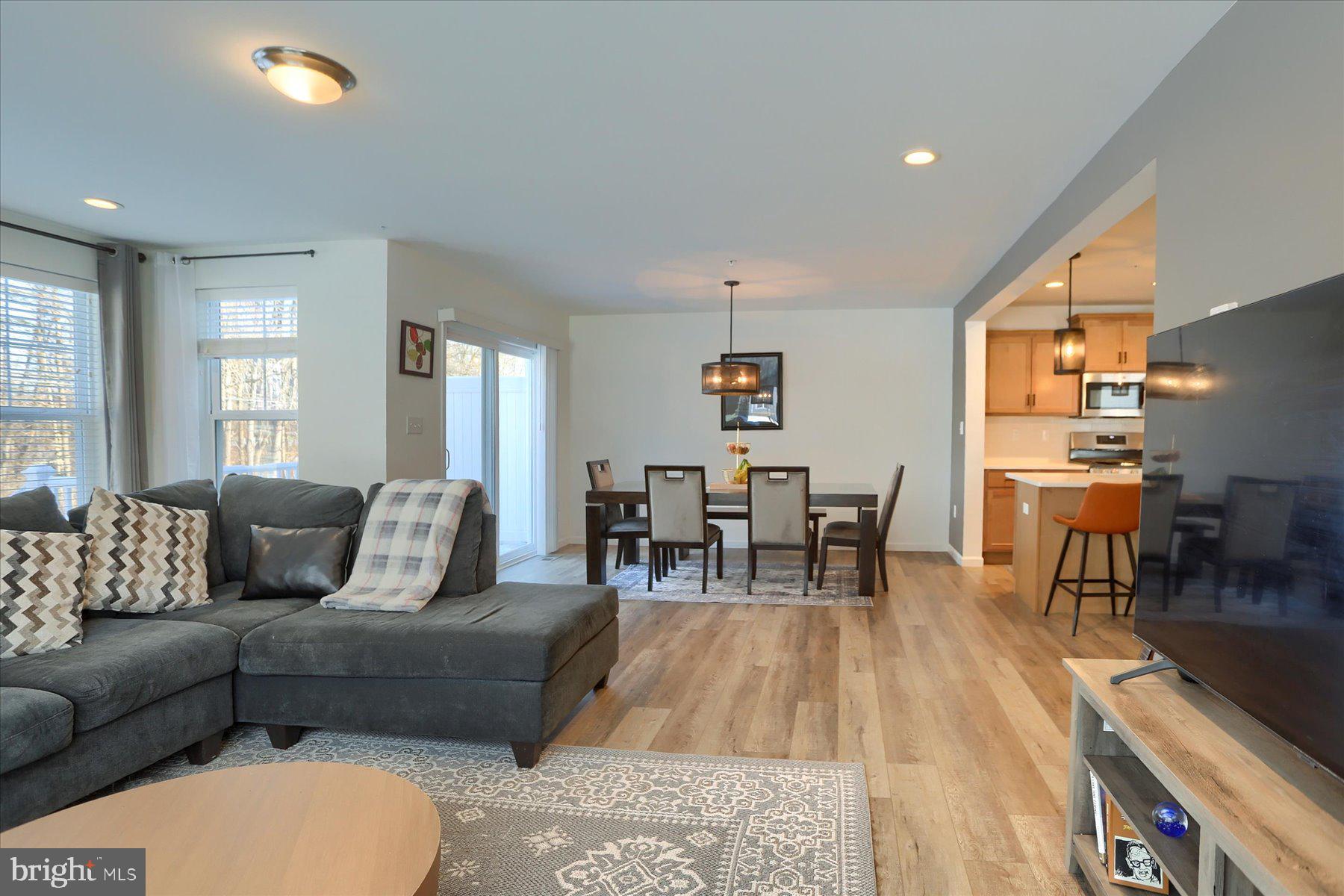 110 Emma Circle Harrisburg, PA 17112 - Photo 14 of 32 a living room with furniture and a dining table with kitchen view