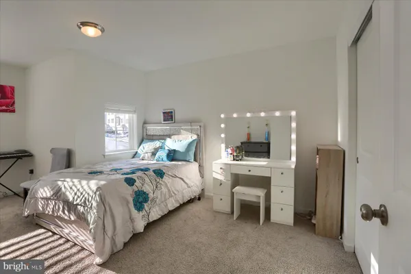 a bedroom with a bed and a table