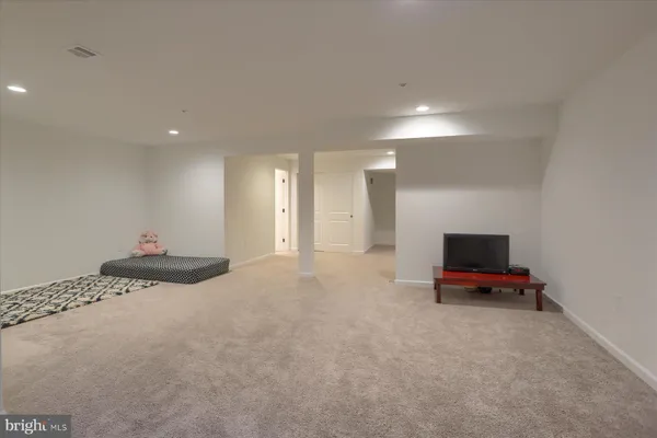 a bedroom with a bed and a chair