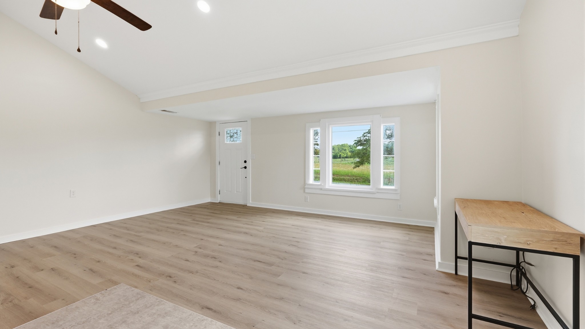 469 Fred Cooper Road McMinnville, TN 37110 - Photo 8 of 46 wooden floor in an empty room with a window