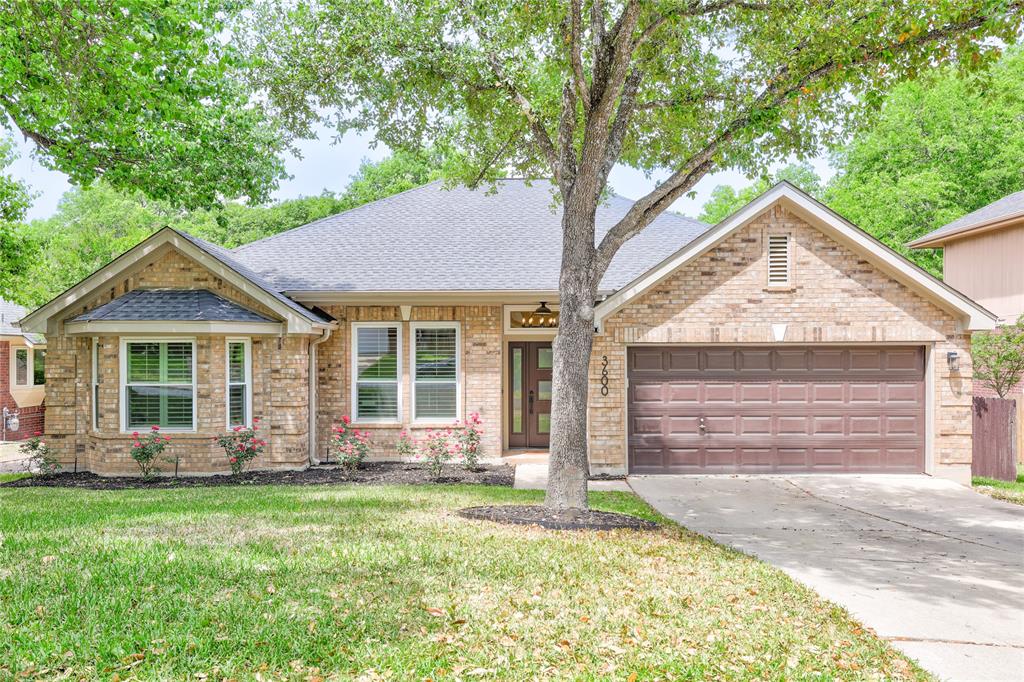 3600 Rip Ford Drive Austin, TX 78732 - Photo 2 of 32 front view of a house with a yard