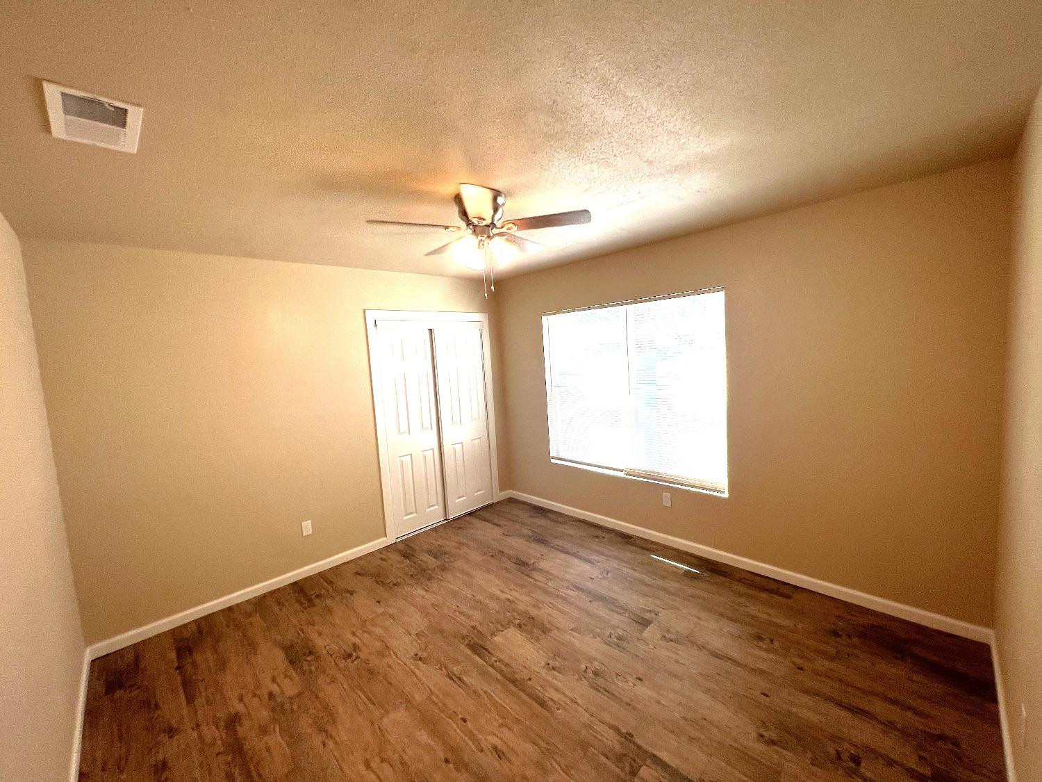 1904 17th Street, Unit A Lubbock, TX 79401 - Photo 7 of 12 a view of an empty room and a window