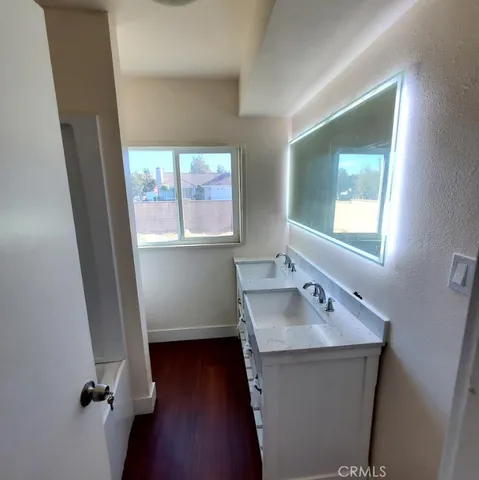 a bathroom with a sink and a window