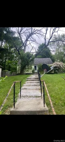 a view of a park with large trees
