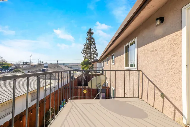 a view of a chairs and table in patio with potted plants