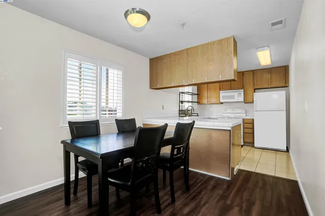 a kitchen with stainless steel appliances a stove a sink and a refrigerator