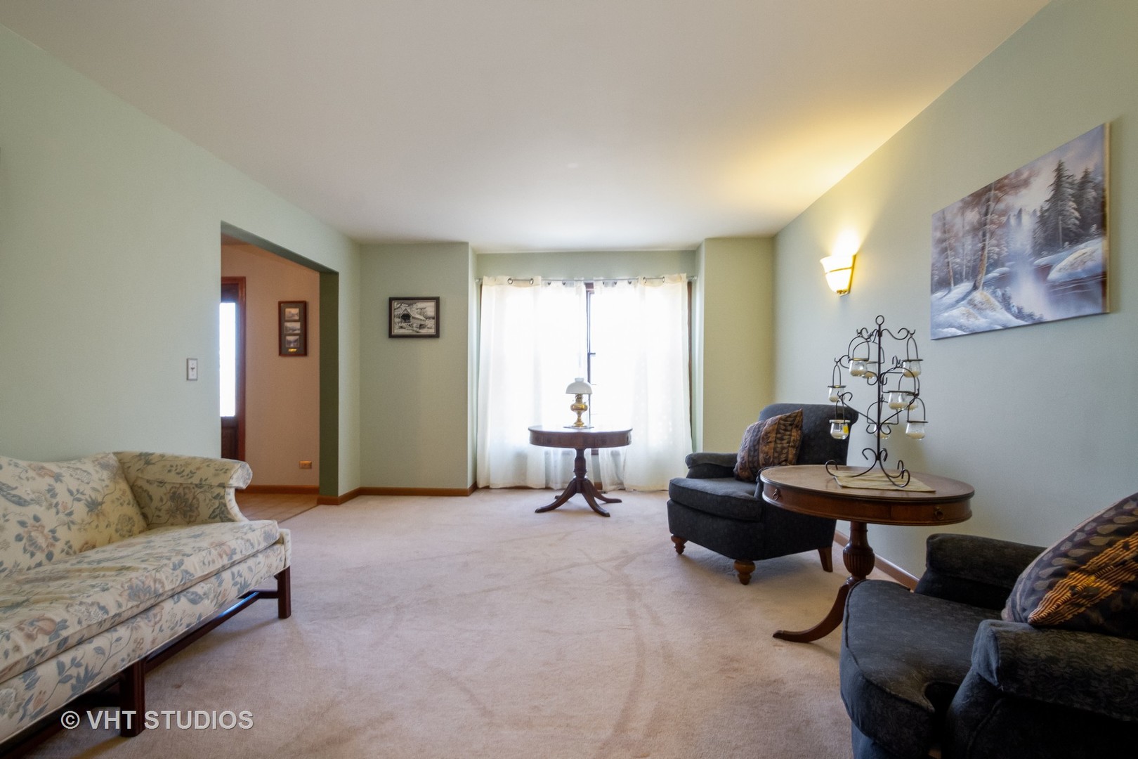 6514 Johnson Road Hebron, IL 60034 - Photo 11 of 17 a living room with furniture and a potted plant on table