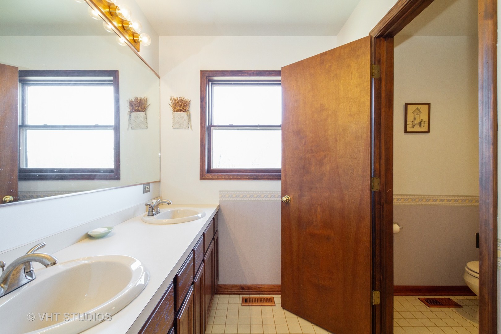 6514 Johnson Road Hebron, IL 60034 - Photo 17 of 17 a bathroom with a granite countertop sink and a mirror