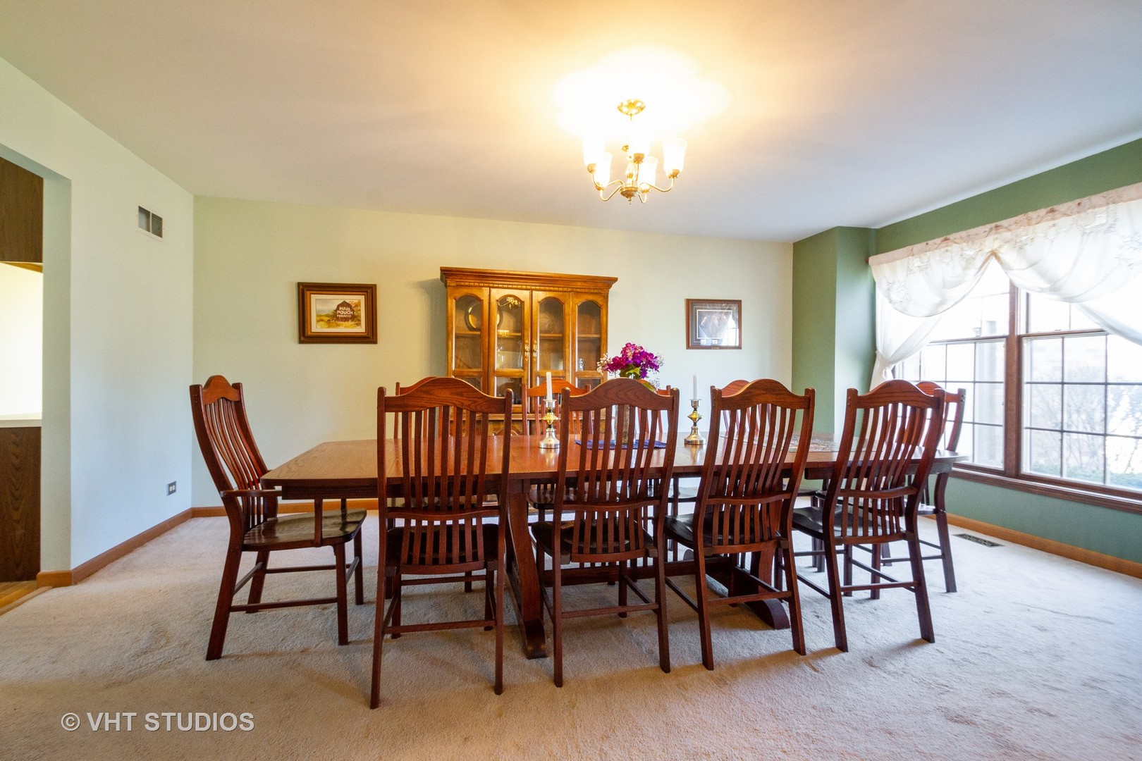 6514 Johnson Road Hebron, IL 60034 - Photo 8 of 17 a view of a dining room with furniture a chandelier and wooden floor