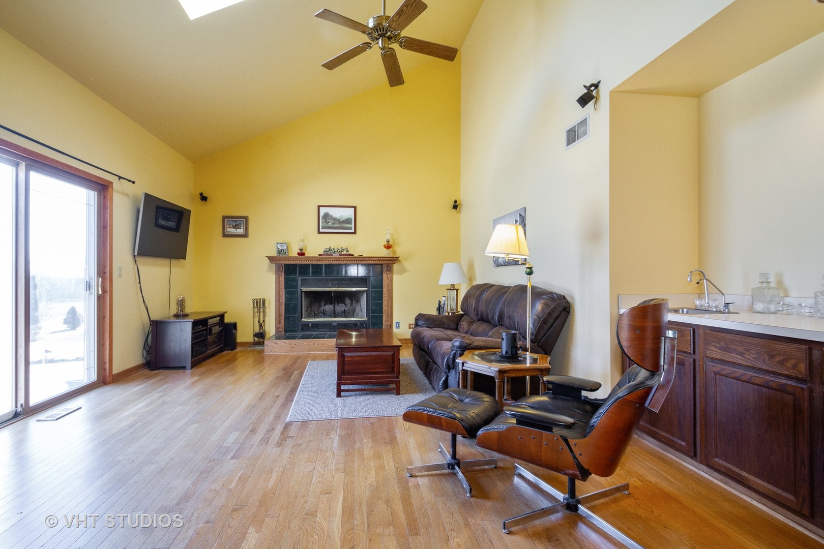 6514 Johnson Road Hebron, IL 60034 - Photo 9 of 17 a living room with furniture and a fireplace
