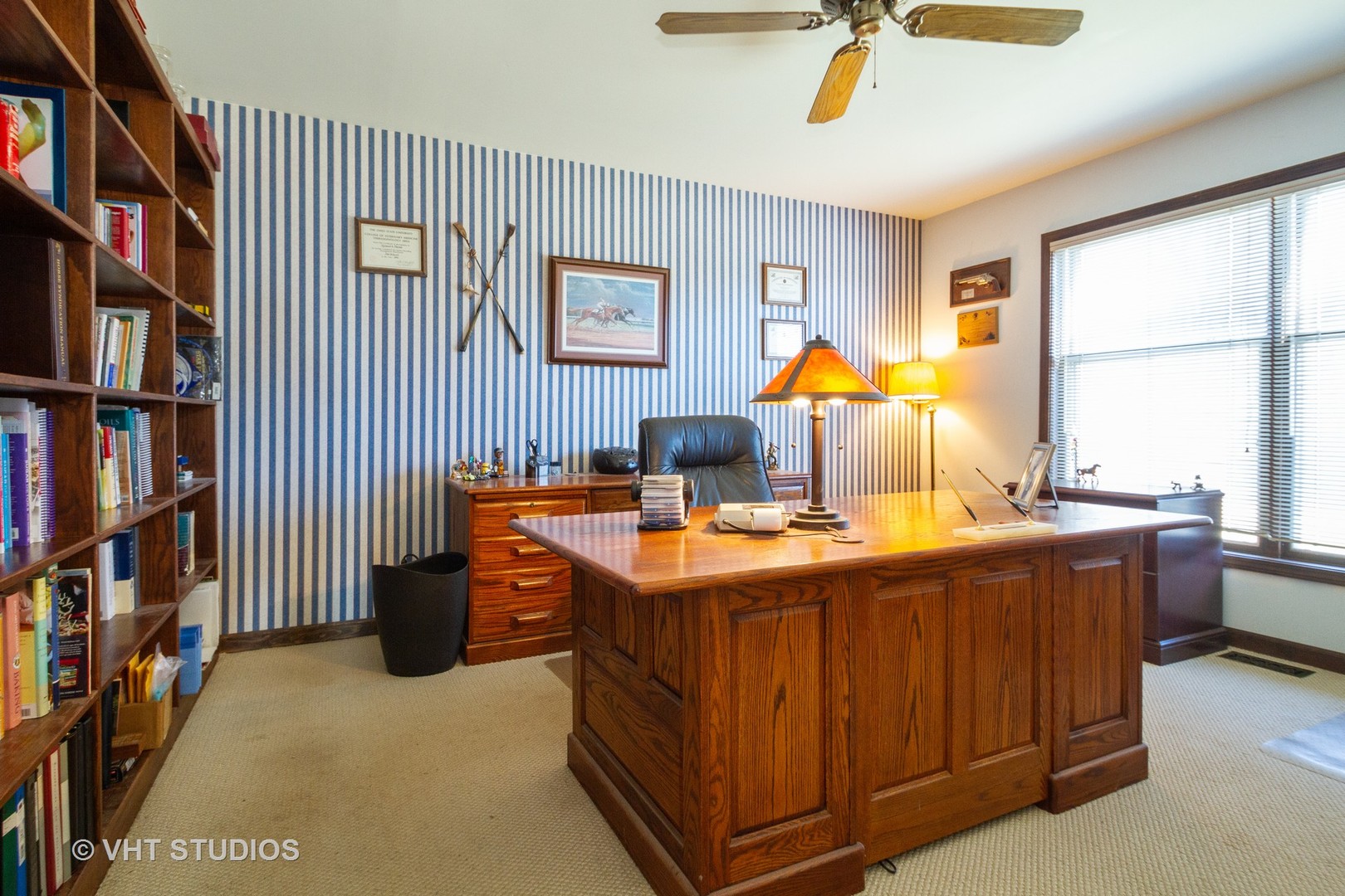 6514 Johnson Road Hebron, IL 60034 - Photo 10 of 17 a view of a workspace with furniture and a bookshelf