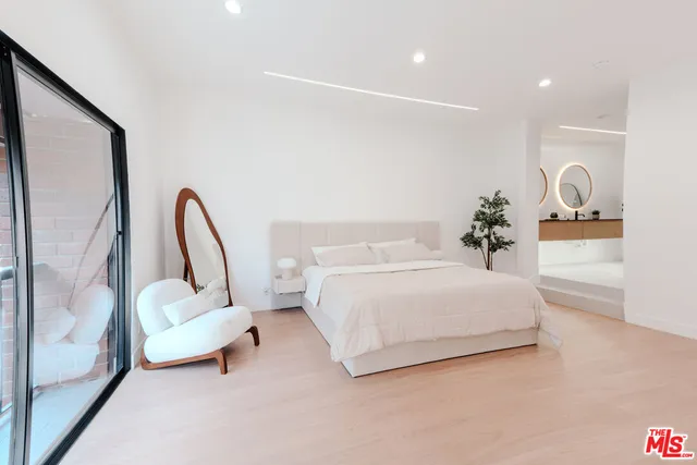 a view of a bathroom with a sink and shower