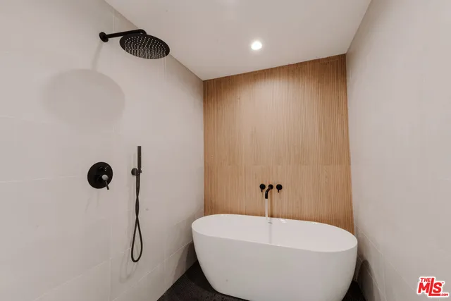a bathroom with a double vanity sink mirror and toilet