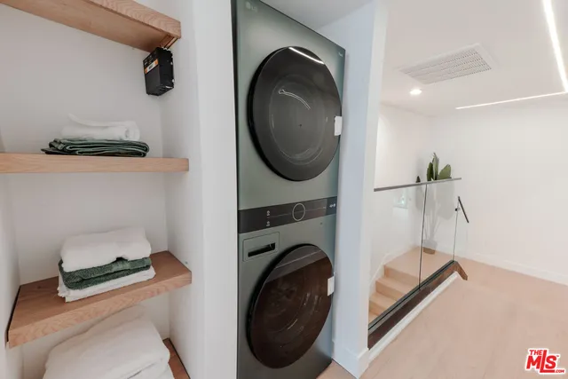 an aerial view of a house with fountain and potted plants