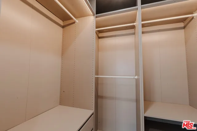 a front view of a house with a yard and fountain