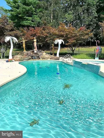 a view of a garden with a tree in front of it