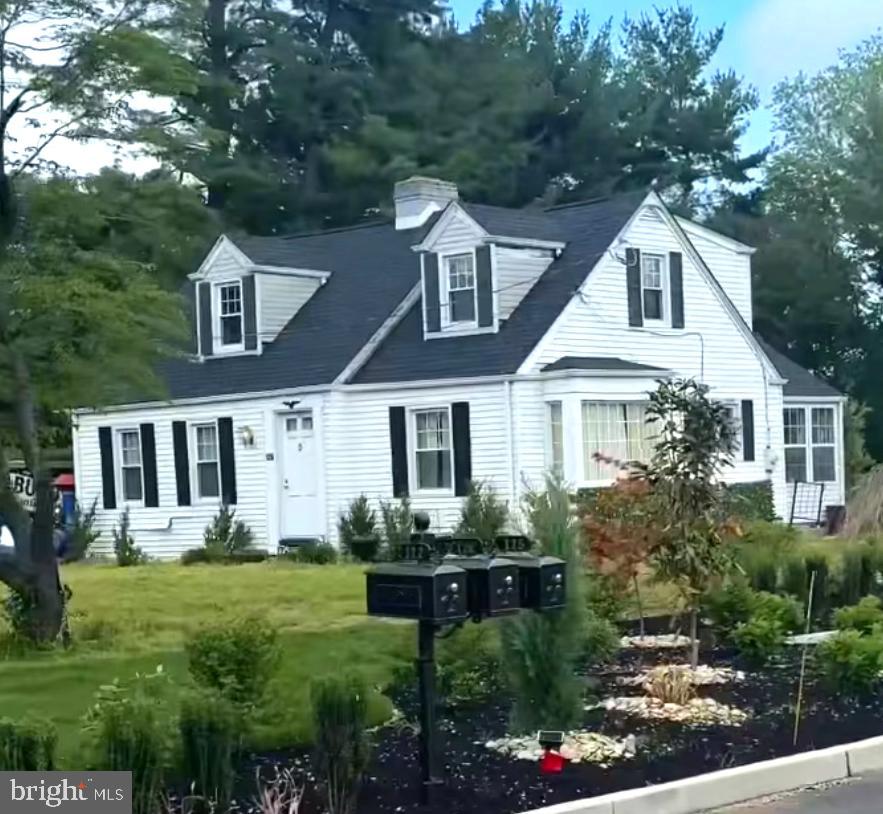 122-124 Salina Road Sewell, NJ 08080 - Photo 27 of 27 a front view of a house with a yard and potted plants