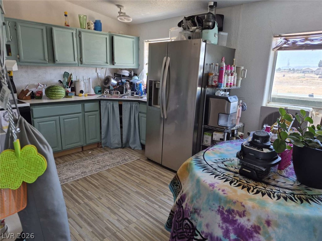 2271 Tough Boy Road Pahrump, NV 89060 - Photo 6 of 12 Functional kitchen with ample cabinet space, a practical layout, and direct natural light.