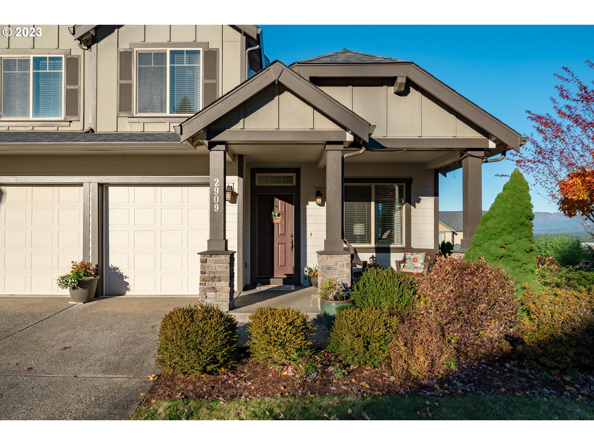 2909 Northwest Hill Street Camas, WA 98607 - Photo 2 of 42 a view of a house with potted plants and more windows