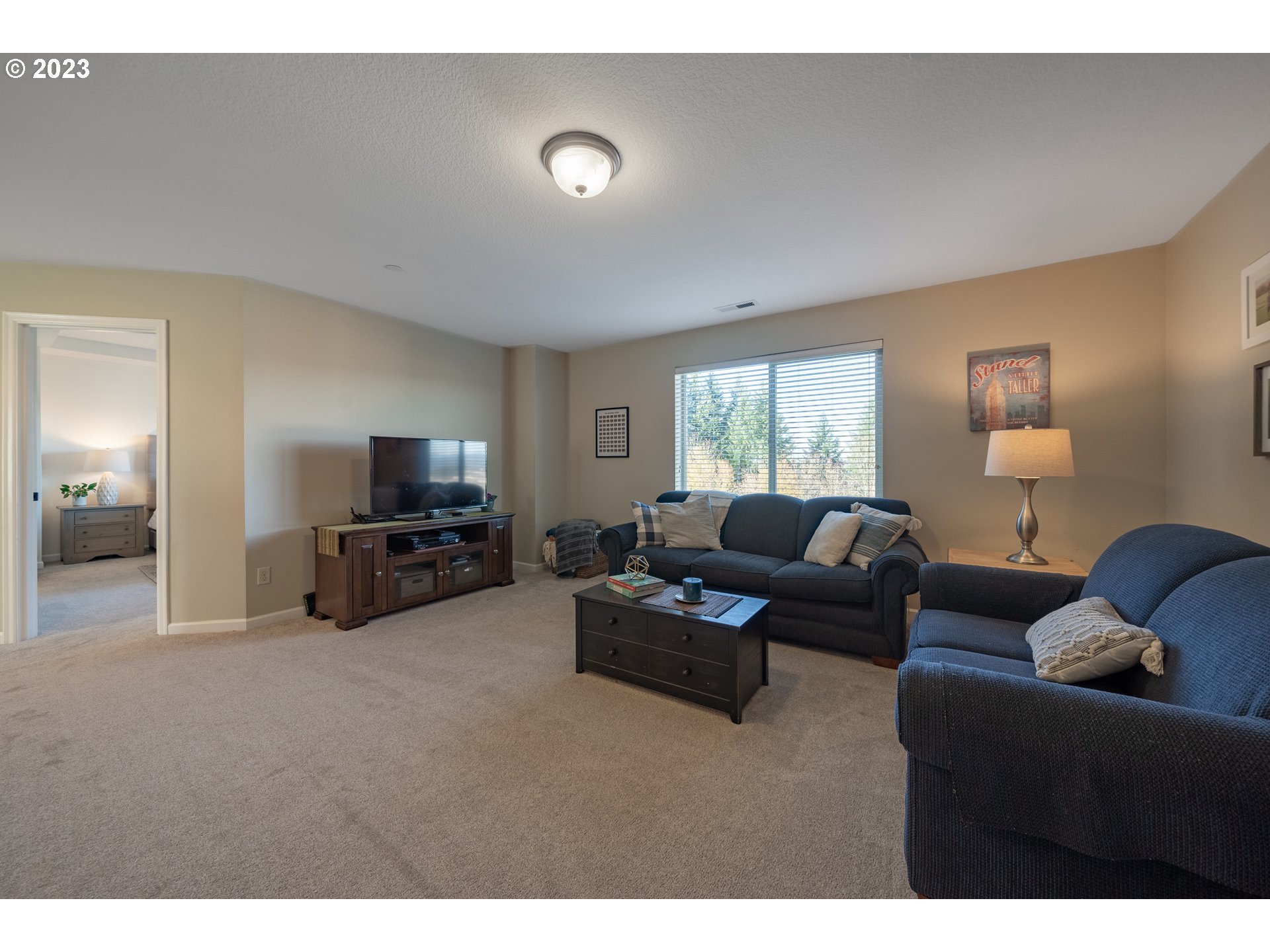 2909 Northwest Hill Street Camas, WA 98607 - Photo 23 of 42 a living room with furniture and a flat screen tv
