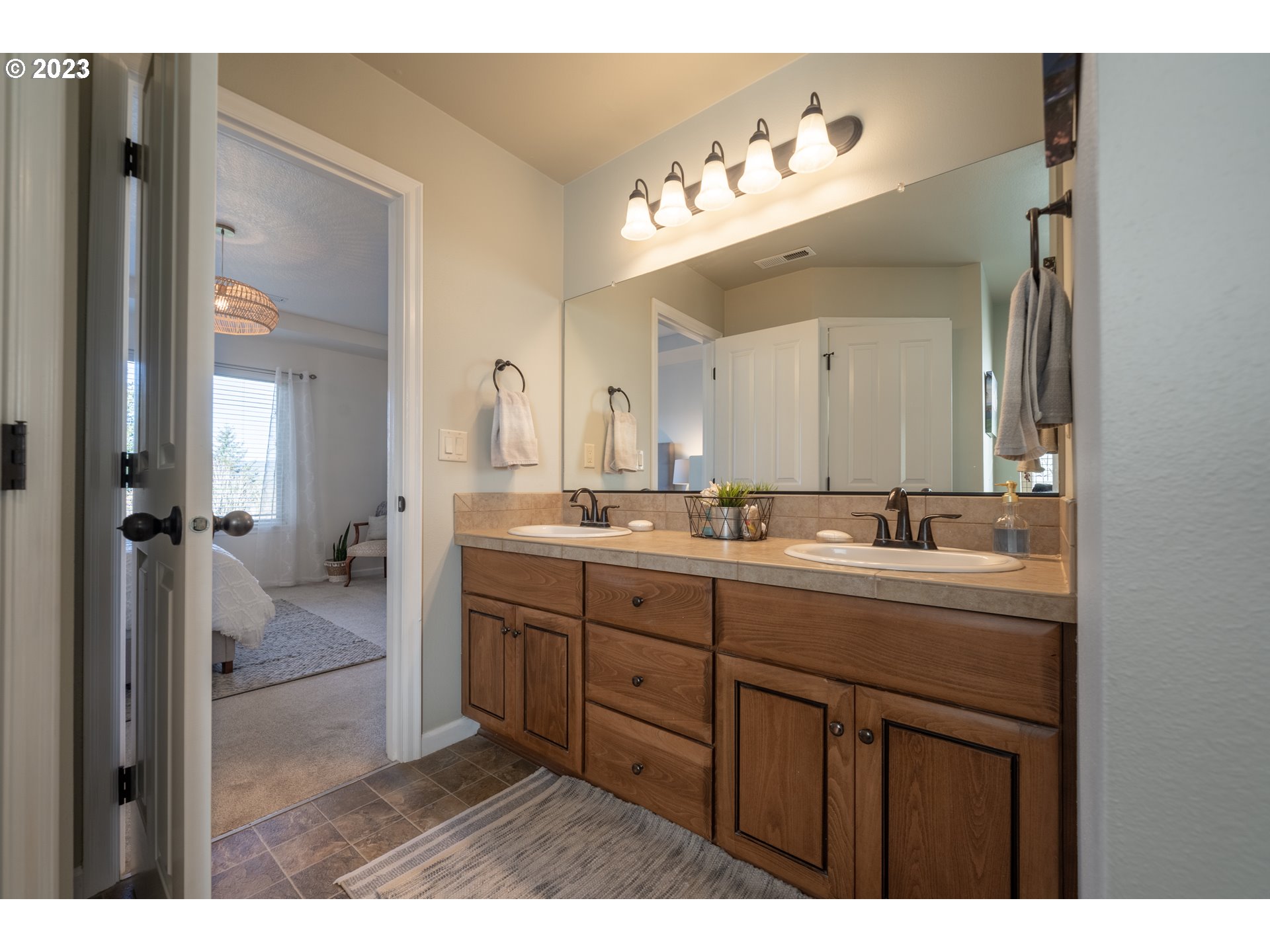 2909 Northwest Hill Street Camas, WA 98607 - Photo 26 of 42 a bathroom with a sink vanity and a mirror