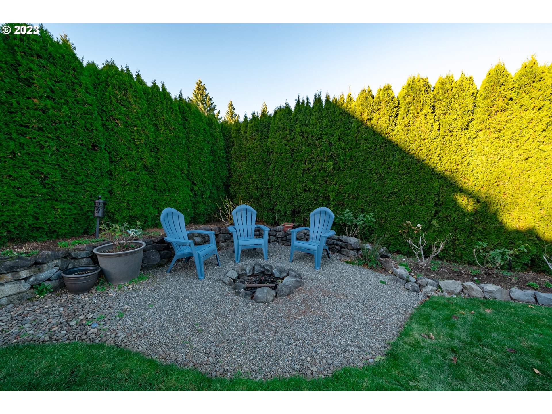 2909 Northwest Hill Street Camas, WA 98607 - Photo 38 of 42 a view of a backyard with plants and chairs