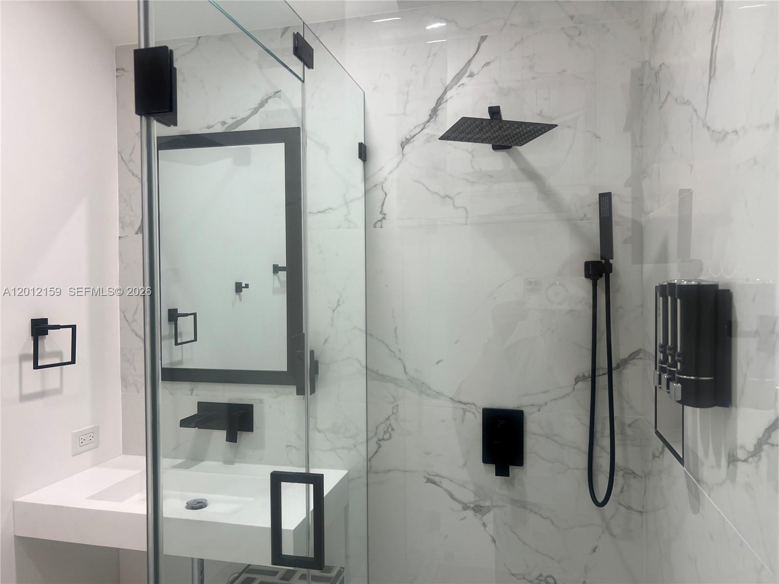 13595 Southwest 99th Street Miami, FL 33186 - Photo 33 of 44 a bathroom with a shower