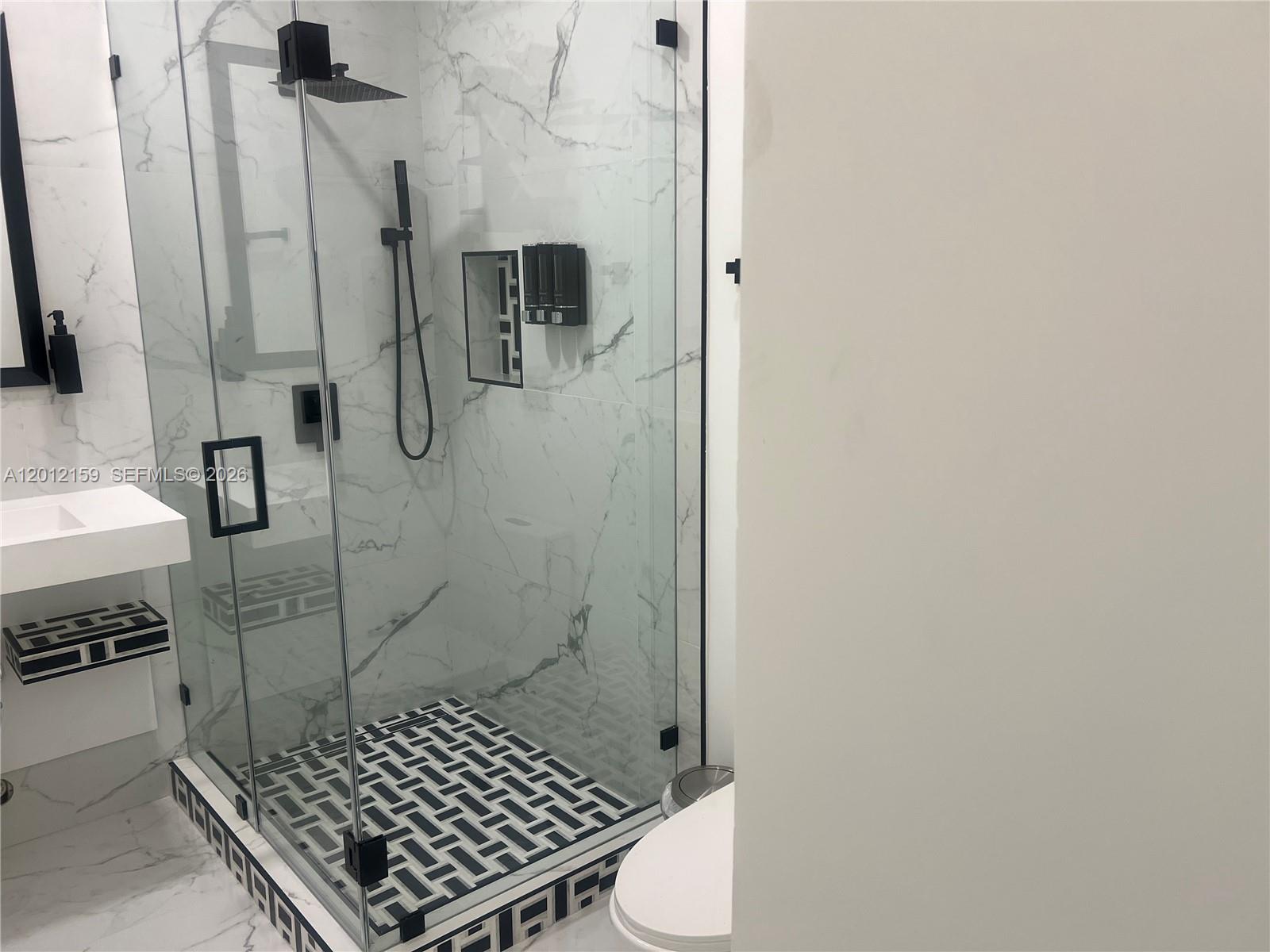13595 Southwest 99th Street Miami, FL 33186 - Photo 34 of 44 a bathroom with a shower