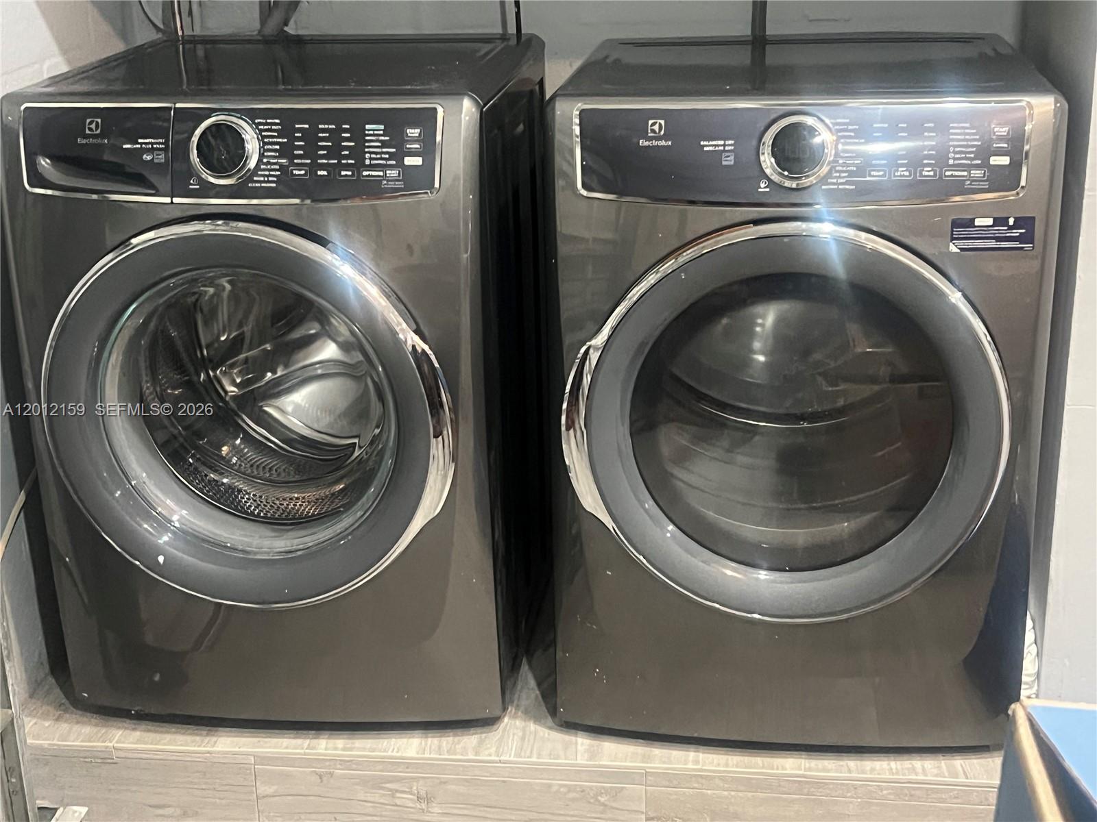 13595 Southwest 99th Street Miami, FL 33186 - Photo 44 of 44 a close up view of a washer and dryer