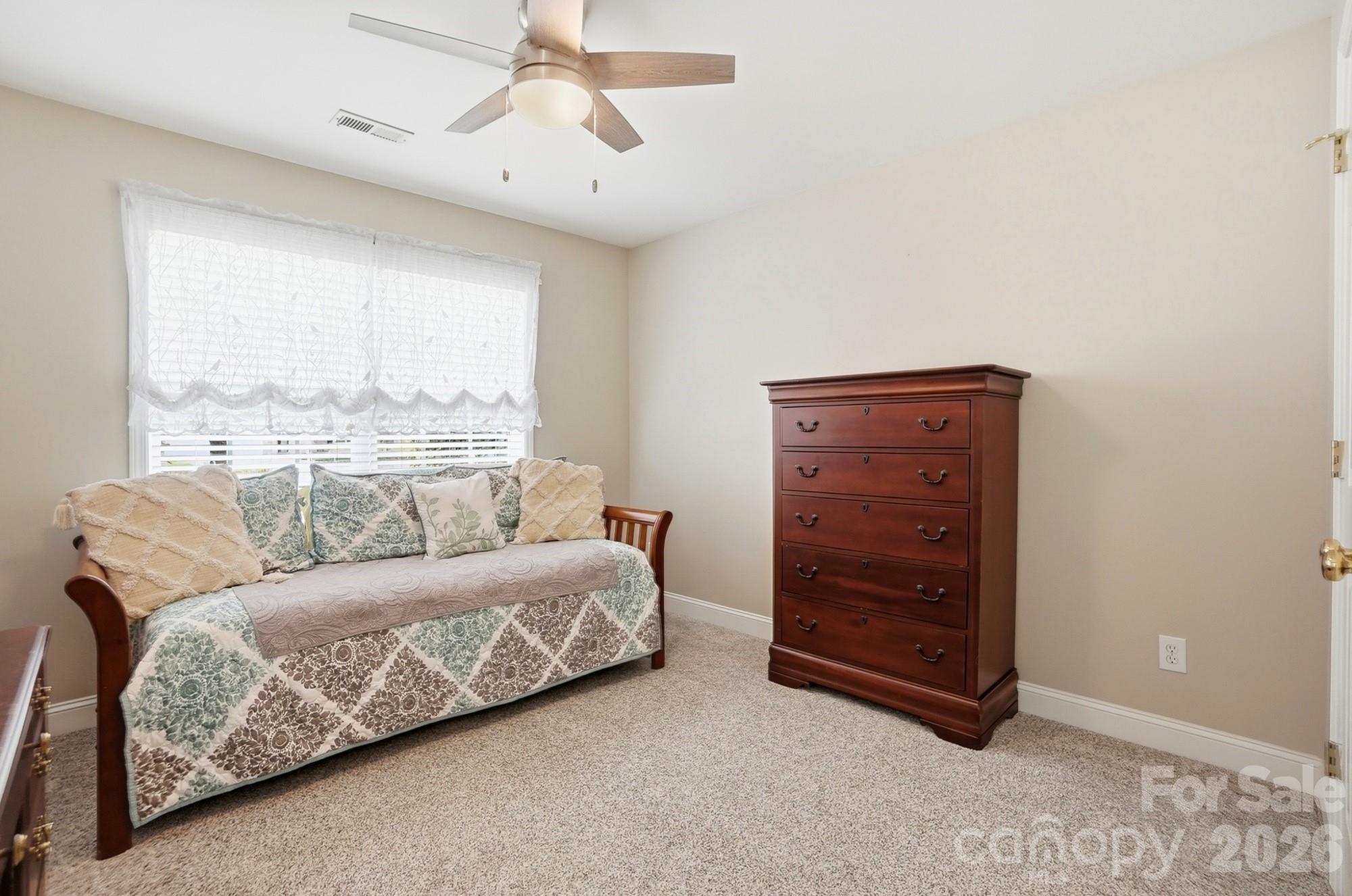 3324 Muddy Creek Road Midland, NC 28107 - Photo 32 of 46 a bedroom with a bed and a dresser