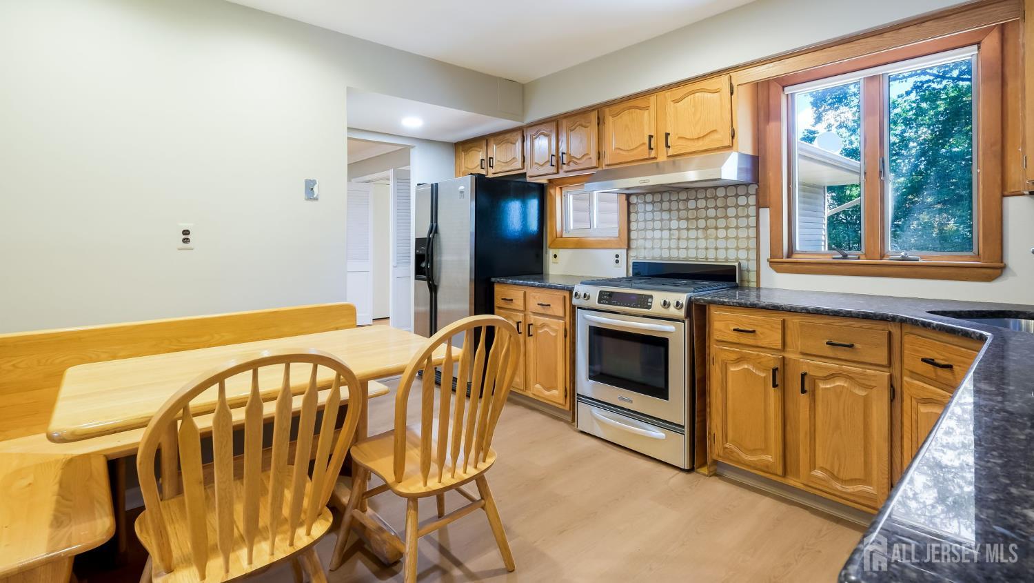 50 Sand Hills Road Kendall Park, NJ 08824 - Photo 10 of 27 a view of a kitchen with a stove top oven