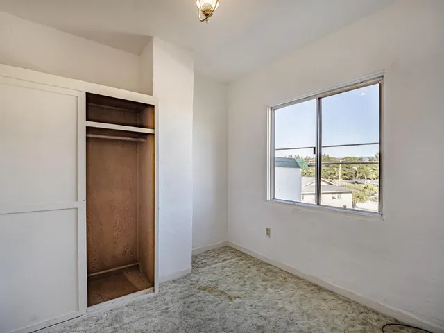 a view of livingroom with furniture workspace and window