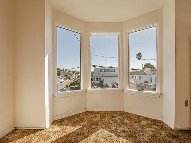 an empty room with windows