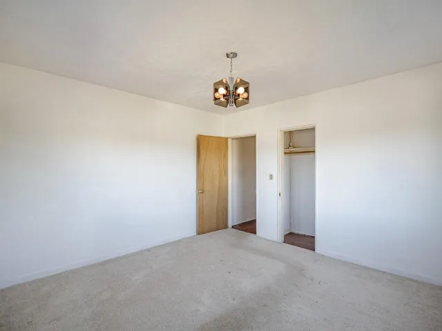a view of empty room with wooden walls