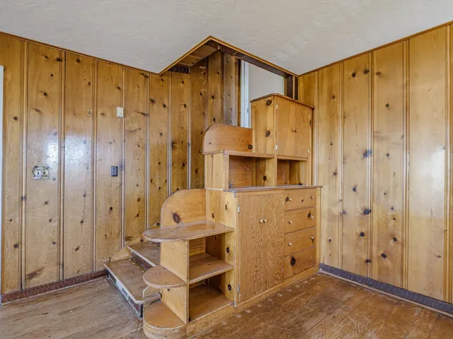 a view of livingroom with furniture window and front door