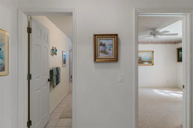 a bathroom with a bathtub shower sink mirror and toilet