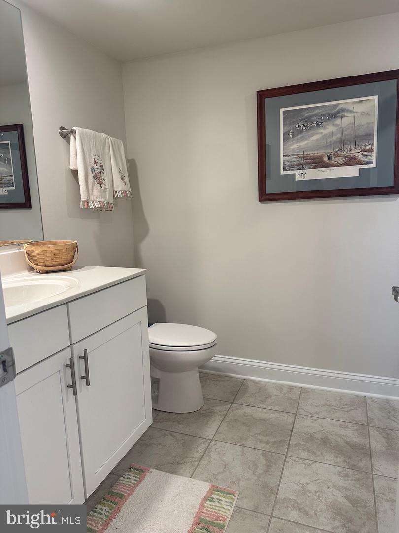 35393 Wright Way Millsboro, DE 19966 - Photo 16 of 28 a white toilet sitting next to a bathroom sink