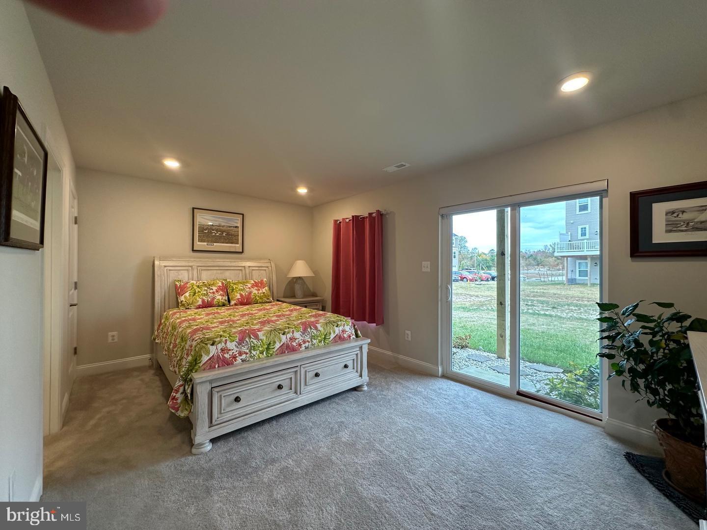 35393 Wright Way Millsboro, DE 19966 - Photo 17 of 28 a spacious bedroom with a bed and a window