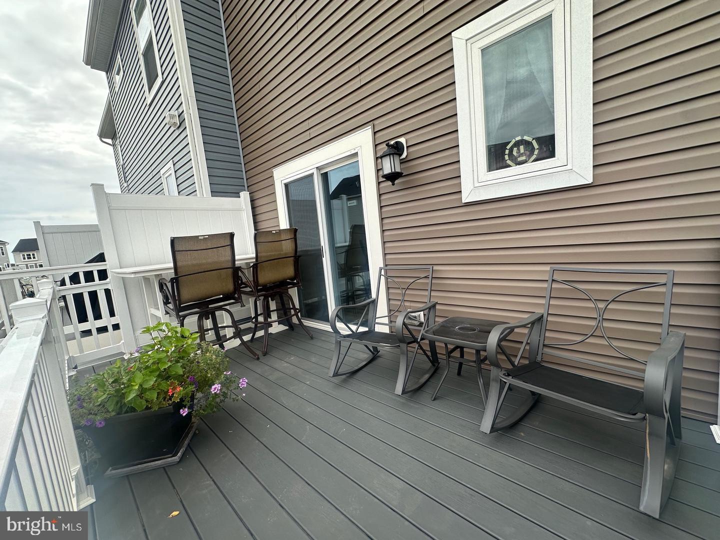 35393 Wright Way Millsboro, DE 19966 - Photo 3 of 28 a view of a patio with chairs and potted plants