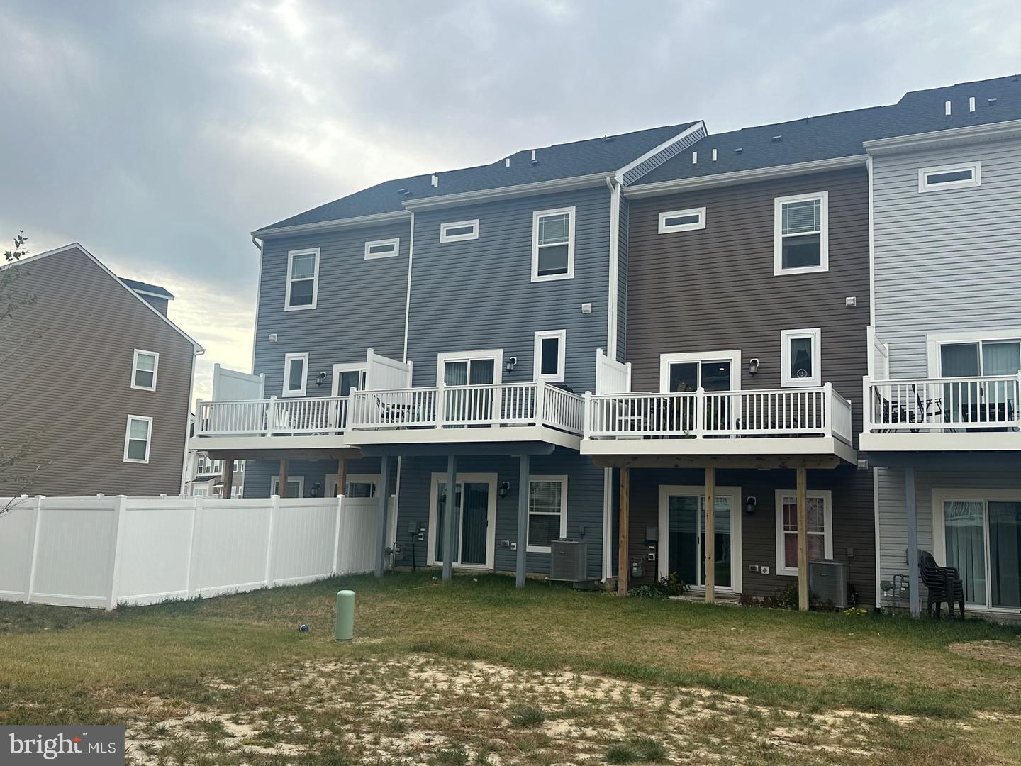 35393 Wright Way Millsboro, DE 19966 - Photo 4 of 28 a view of a building with a lot of windows