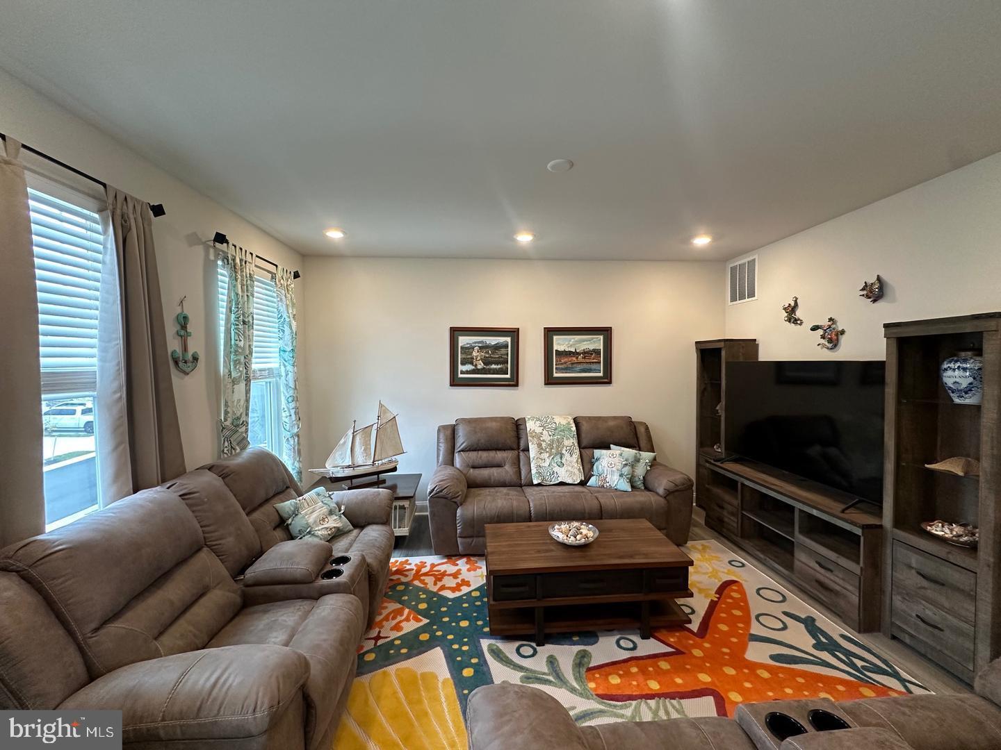 35393 Wright Way Millsboro, DE 19966 - Photo 10 of 28 a living room with furniture and a flat screen tv