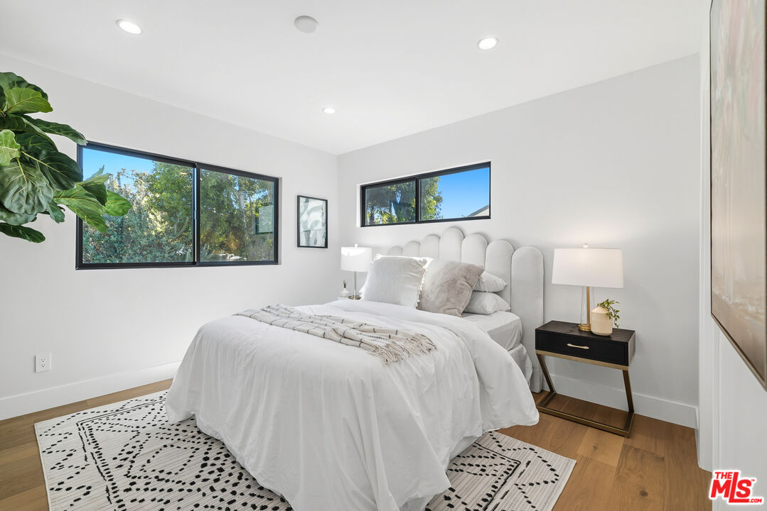 5032 Bluebell Avenue Valley Village, CA 91607 - Photo 14 of 75 a bedroom with a large bed and a window