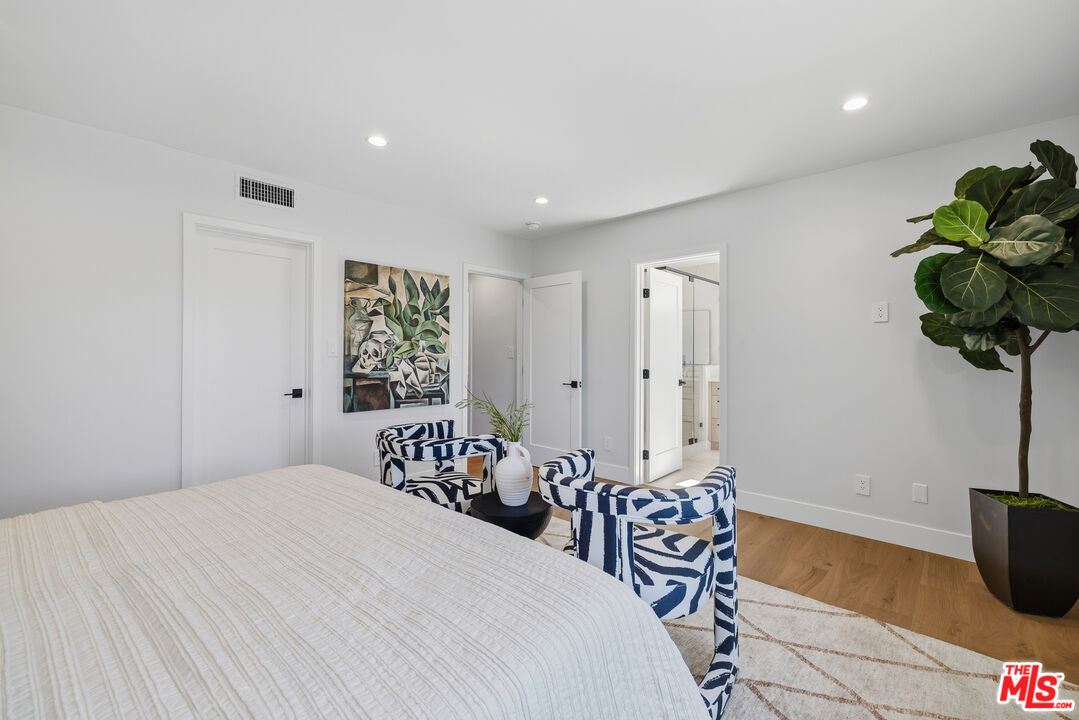 5032 Bluebell Avenue Valley Village, CA 91607 - Photo 18 of 75 a bedroom with a bed and a table