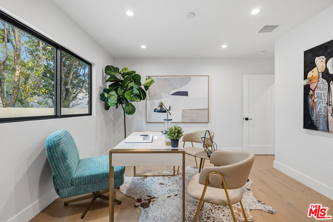 5032 Bluebell Avenue Valley Village, CA 91607 - Photo 28 of 75 a living room with furniture and a potted plant