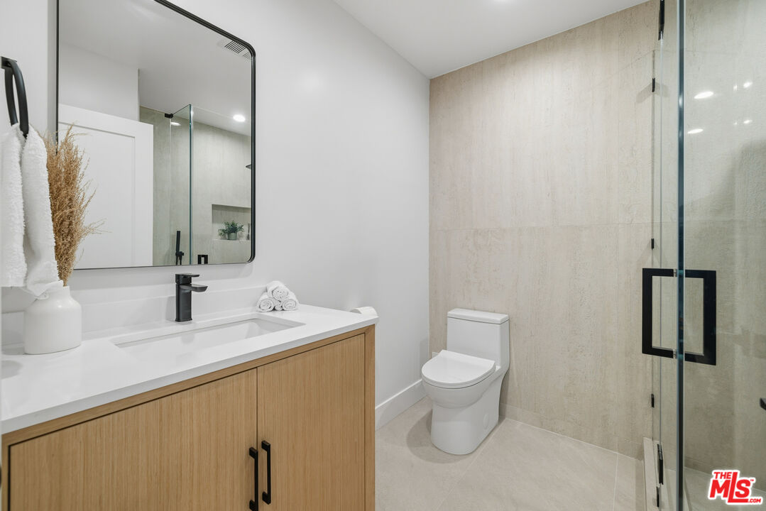 5032 Bluebell Avenue Valley Village, CA 91607 - Photo 29 of 75 a bathroom with a sink toilet and shower