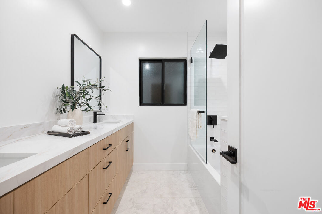 5032 Bluebell Avenue Valley Village, CA 91607 - Photo 31 of 75 a bathroom with a sink and a mirror