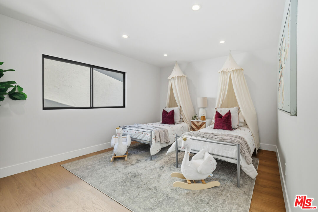 5032 Bluebell Avenue Valley Village, CA 91607 - Photo 32 of 75 a living room with furniture and wooden floor