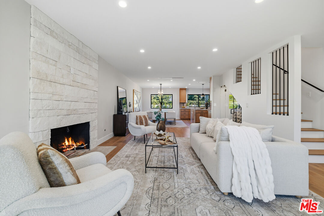 5032 Bluebell Avenue Valley Village, CA 91607 - Photo 38 of 75 a living room with furniture and a fireplace