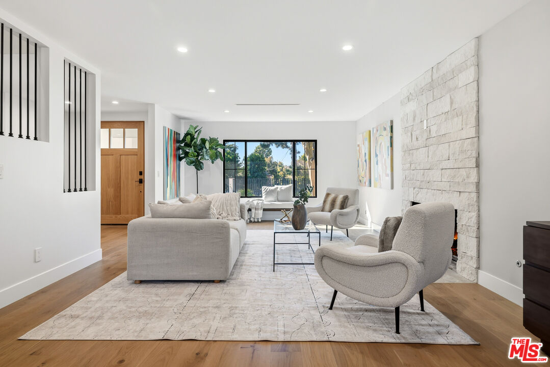 5032 Bluebell Avenue Valley Village, CA 91607 - Photo 47 of 75 a living room with furniture and a large window